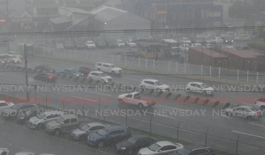 Heavy traffic during rainfall on Wrightson Road, Port of Spain. - File photo/Anisto Alves