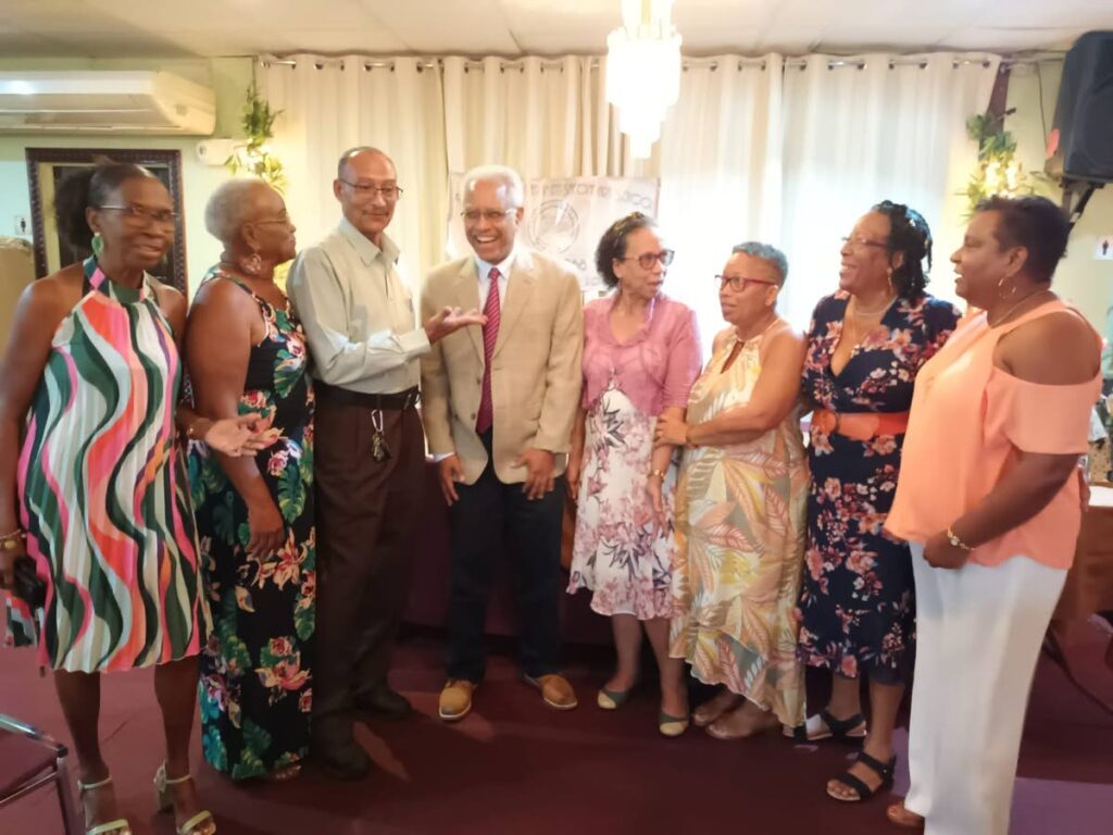 Administrator Judy Joseph-Pacheco of the RCGSS class of 1973 reunion group, second from left; group chairman Gregory Worrell, third from left; and other members of the executive committee chat with chairman of the Fair Trade Commission Dr Ronald Ramkissoon, fourth from left.