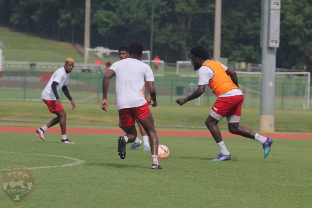 TT midfielder Neveal Hackshaw (R) controls the ball during a team training session, on Saturday, ahead of Sunday's Concacaf Gold Cup Group A match against the US. - TTFA Media