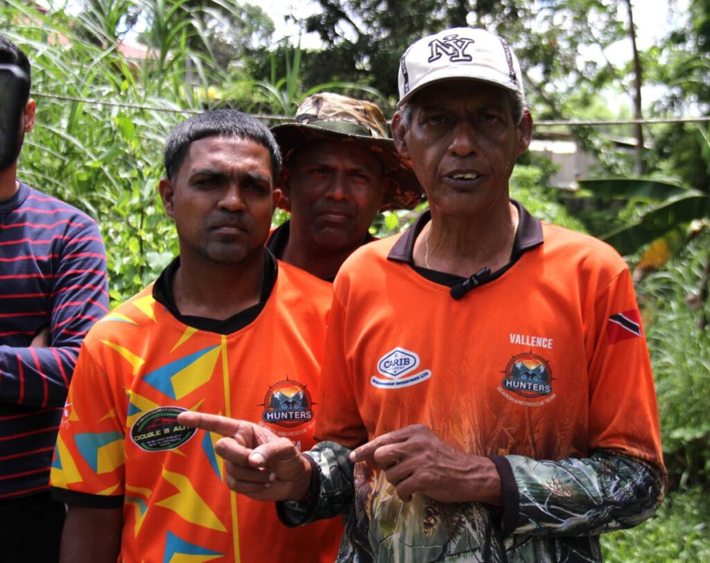 Captain Vallence Rambharat, with members of the Hunters' Search and Rescue Team. -