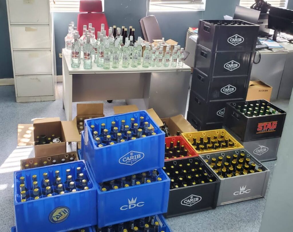 The large quantity of alcohol seized by police during a raid in Enterprise, Chaguanas, on Friday. - Courtesy TTPS