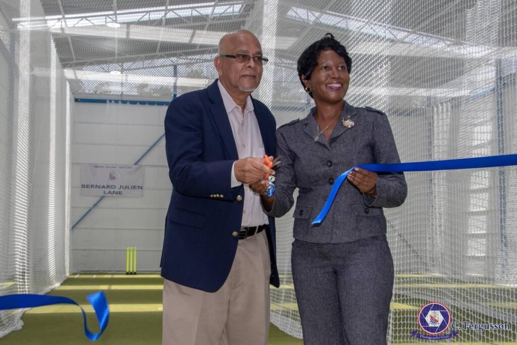 Azim Bassarath, left, Cricket West Indies vice-president and TT Cricket Board president and Shelly Slater, curriculum officer, physical education at Ministry of Education cut the ribbon to open the Bernard Julien Lane. The other two lanes are the Charlie Davis and Clifford Roach Lanes. - 