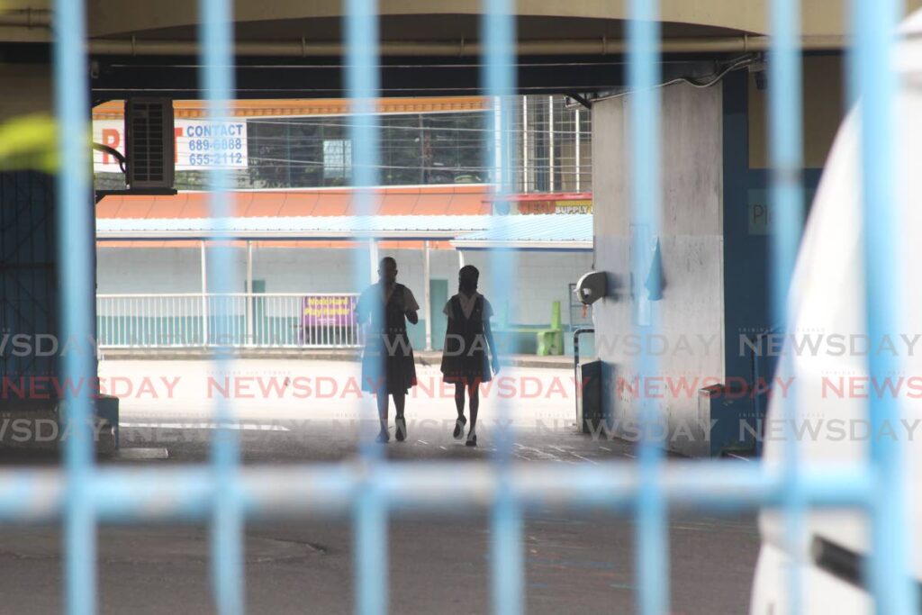 Two students are seen in the courtyard of Grant Memorial Presbyterian School on July 3. - Lincoln Holder