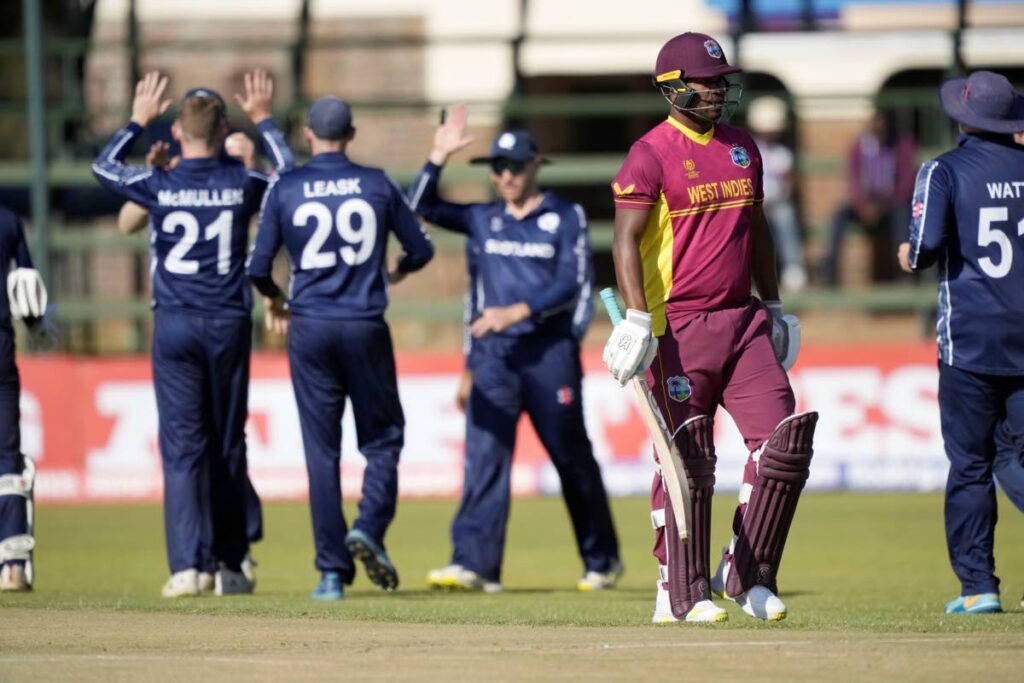 Scotland players celebrate a wicket, during the CC Men's Cricket World Cup Qualifier match against the West Indies and Scotland, at Harare Sports Club, in Harare, Zimbabwe, on Saturday.  - AP PHOTO