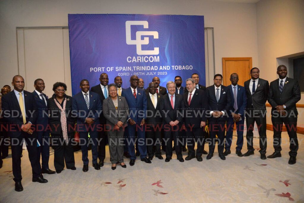 UN Secretary General Antonio Guterres, sixth from right, with Caricom leaders at the opening session of the 45th heads of government meeting at Hyatt Regency, Port of Spain on Monday. - ANISTO ALVES