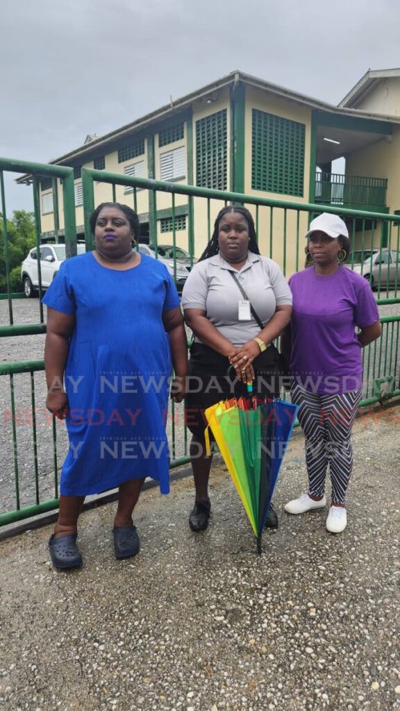 From left, Giselle Lewis, president of the PTA of the 5th Company Baptist Primary School in Moruga, Jemima Lewis Ragbir, PTA secretary and Petra Garcia Bramble, PTA vice secretary, outside the school on Tuesday. - Photo by Yvonne Webb 