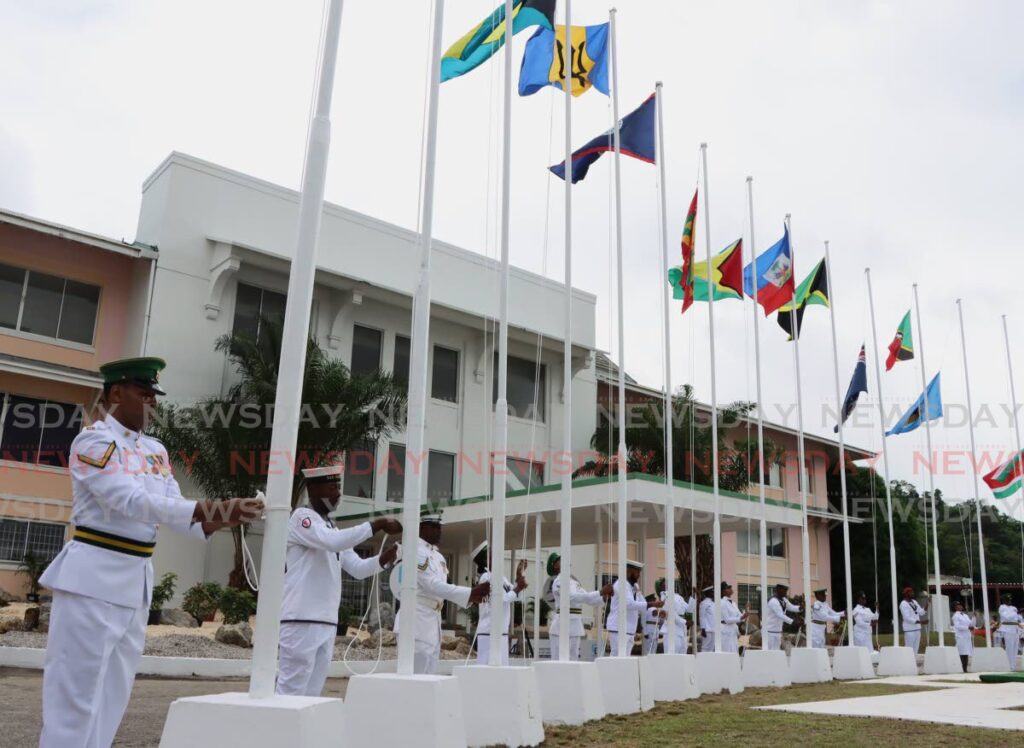 The flags of Caricom member states are raised duriing a ceremony to commemorate the 50th anniverary of the Treaty of Chaguaramas at the Chaguaramas Convention Centre on July 4. PHOTO BY ANGELO MARCELLE - 