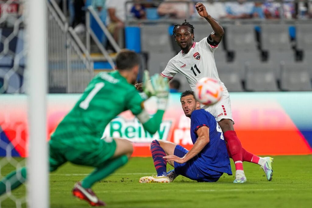 United States goalkeeper Matt Turner blocks a shot by Trinidad and Tobago forward Levi García (11) as Matt Miazga looks on during the second half of a CONCACAF Gold Cup soccer match on Sunday, July 2, 2023, in Charlotte, N.C. - AP PHOTO