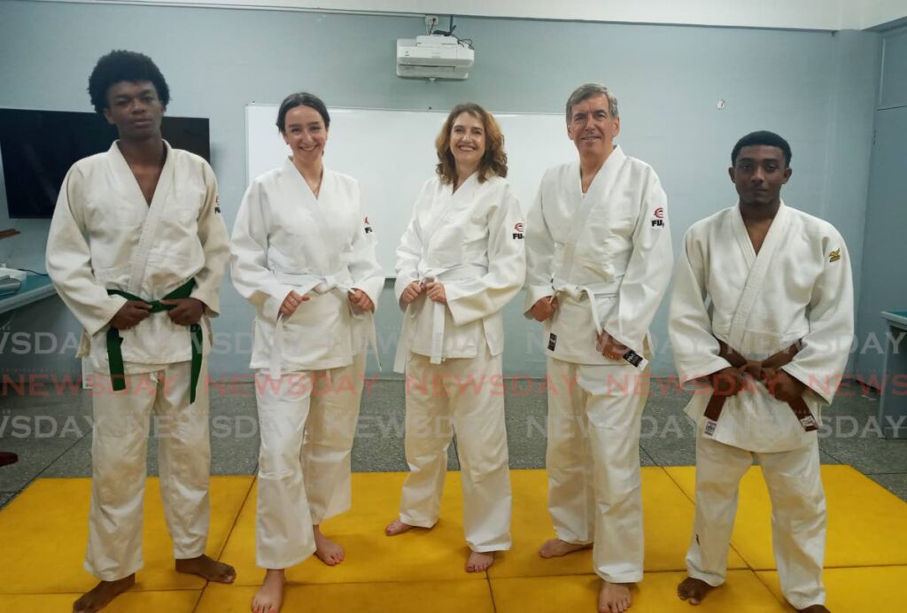 British High Commissioner Harriet Cross, middle, at the launch of the Judo and Oneness with Youth programme at the St Patricks' Newtown Boys' RC School in Newtown on Wednesday.
Also in the photo are athlete Kai Sammy, from left, Phoebe Lundy of the British High Commission, United Kingdom's Minister for the Americas and the Caribbean David Rutley and athlete Giovanni Lopez.  - Jelani Beckles