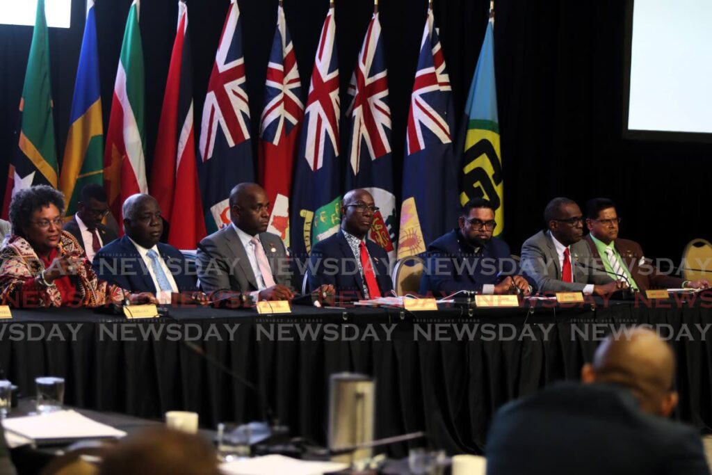 Prime Minister of Barbados Mia Mottley, left, speaks at the closing press conference of the Caricom summit at the Hyatt Regency, Port of Spain on July 5. TT Prime Minister Dr Keith Rowley is at centre. - ANGELO MARCELLE