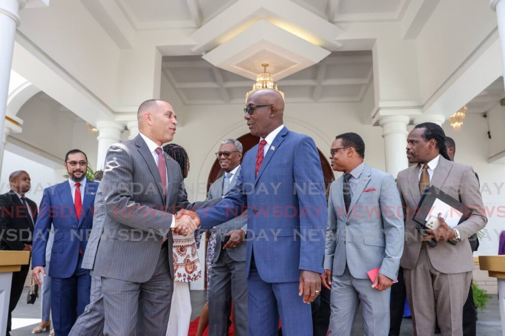US Democratic Leader in the House of Representatives Congressman Hakeem Jeffries, left, greets Prime Minister Dr Keith Rowley before members of government met with a US congressional delegation visiting TT at the Diplomatic Centre, St Ann’s, Port of Spain on Thursday. - Jeff K Mayers