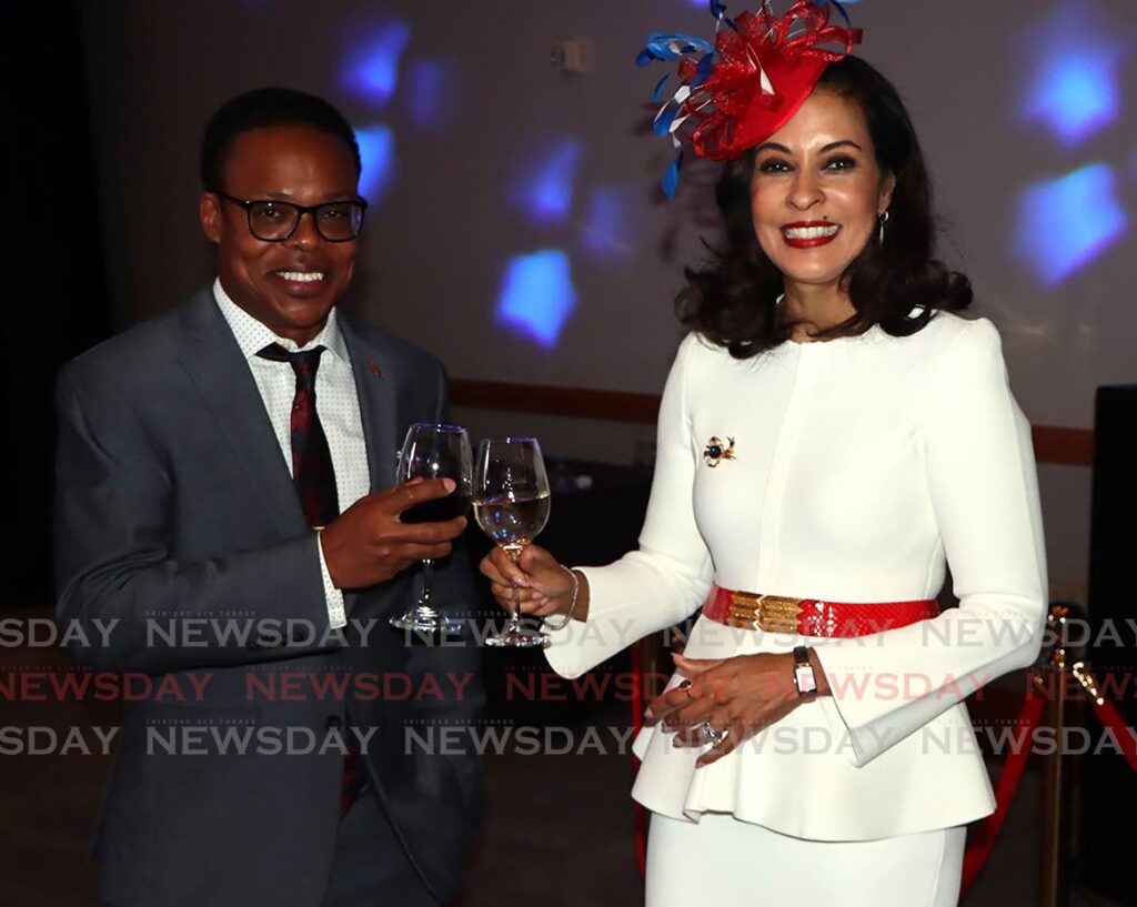 Minister of Foreign and Caricom Affairs Dr Amery Browne and US Ambassador Candace Bond share a toast at the US Embassy's Fourth of July celebrations at Hyatt Regency, Port of Spain on Friday. PHOTO: ANGELO MARCELLE - 