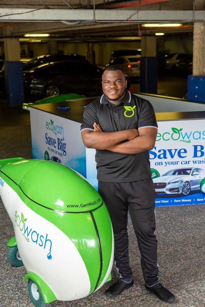 EcoWash founder Dareem Jeffery poses with his unique car-wash machine, which uses only two litres of water and a special mixture of detergents to wash an entire car within 20 minutes. 
(Photo courtesy EcoWash) - 