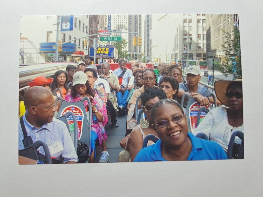 Mausica Teachers' College alumni touring Manhattan, New York, on a double decker bus. - 