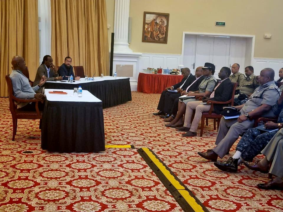 HIGH-LEVEL TALKS: Prime Minsiter Dr Keith Rowley, National Security Minister Fitzgerald Hinds and Energy Minister Stuart Young address security chiefs at a four-hour long meeting at Diplomatic Centre, St Ann's, on Sunday. - Courtesy Office of the Prime Minister