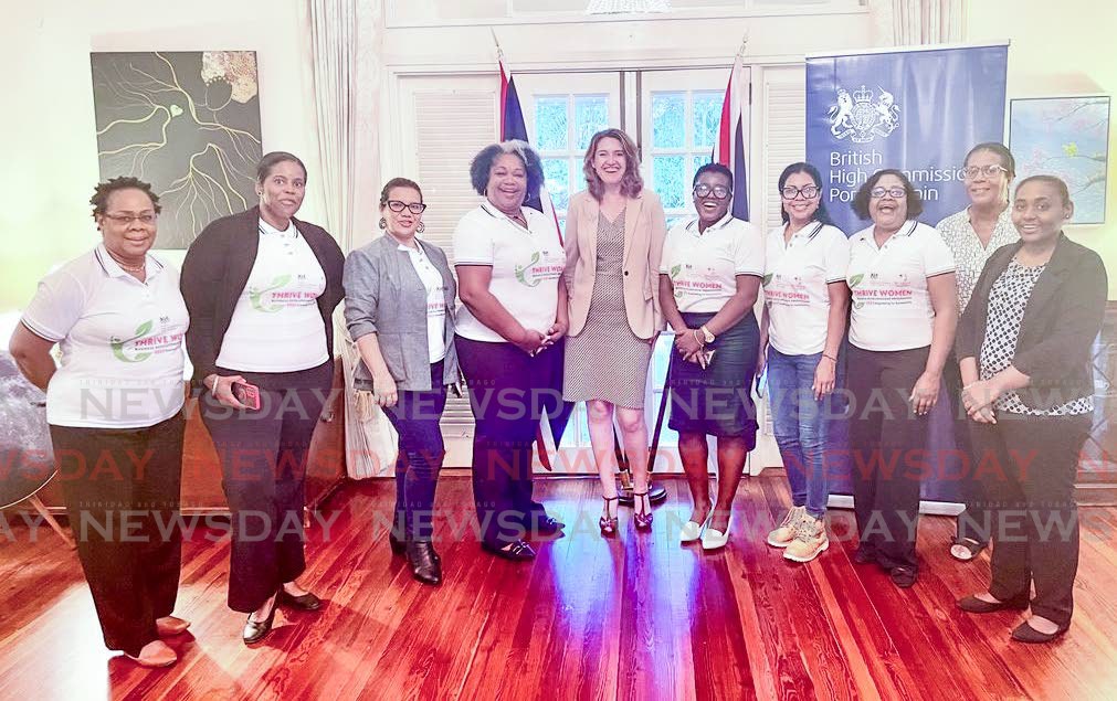  British High Commissioner Harriet Cross, centre, meets participans of a training programme with WOMEN. - Grevic Alvarado