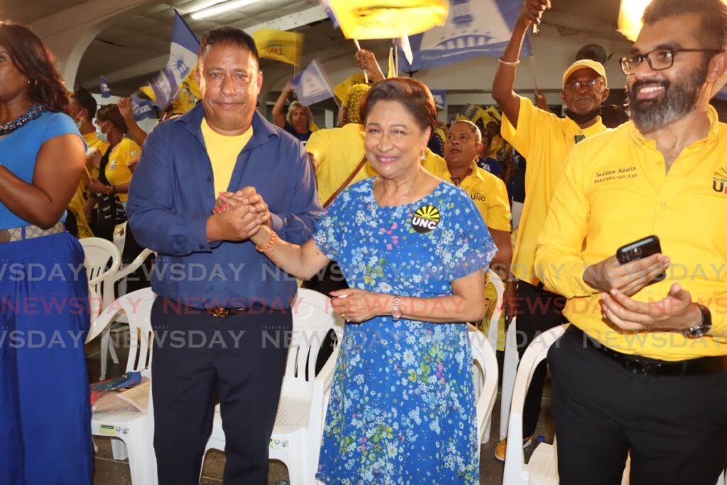 NTA and UNC leaders Gary Griffith and Kamla Persad-Bissessar in solidarity during a joint meeting at SWWTU Hall, Port of Spain on July 19. At right is UNC MP Saddam Hosein.  - Roger Jacob 