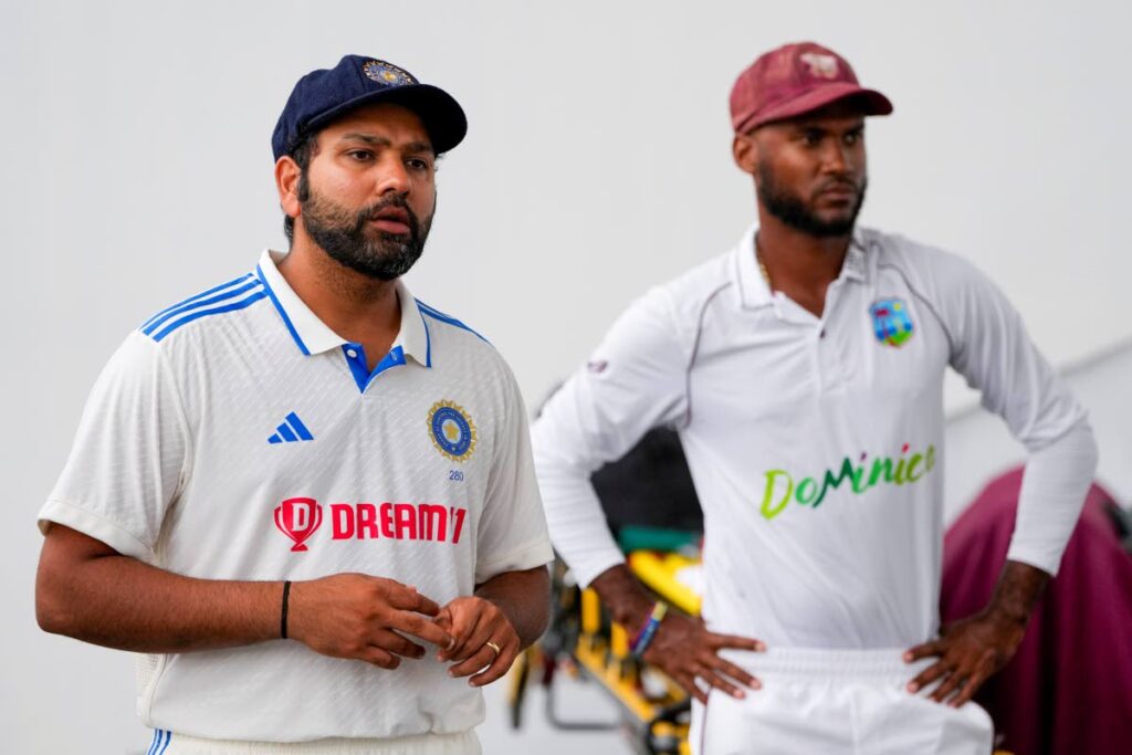India's captain Rohit Sharma, left, and West Indies' capitan Kraigg Brathwaite stand during the awards ceremony at Queen's Park in Port of Spain, Trinidad and Tobago, on Monday, July 24, 2023. India won the two-match Test series after the second Test was drawn with no play possible due to rain on Tuesday. - AP PHOTO