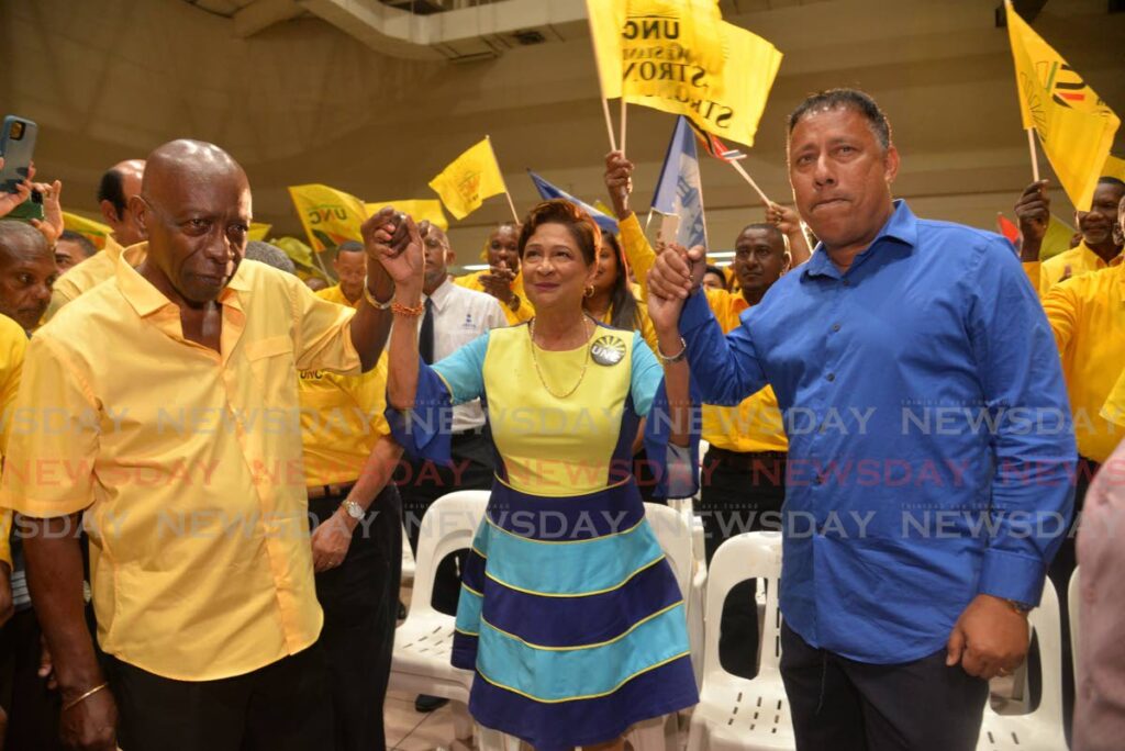 TOGETHER AGAIN: UNC Political Leader Kamla Persad Bissessar, centre, is flanked by NTA political leader Gary Griffith and ILP political leader, Jack Warner, during UNC/NTA political meeting at the Centre Of Excellence, Macoya on Monday. - Anisto Alves