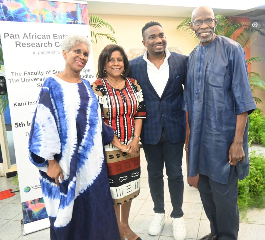 Minister of Trade and Industry Paula Gopee-Scoon (centre) with chairman, PAERC, Dr Ralph Henry; Founder and CEO, WiPay and Colour Bank, Aldwyn Wayne; and Professor Lou Anne Barclay, Mona School of Business, UWI, Mona Campus, Jamaica.   
(Photo courtesy MTI) - 