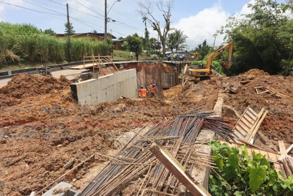 The Ministry of Works continues work at a road rehabilitation project on the Brazil Arena Road, near Cross Country Supermarket on Thursday. - ROGER JACOB