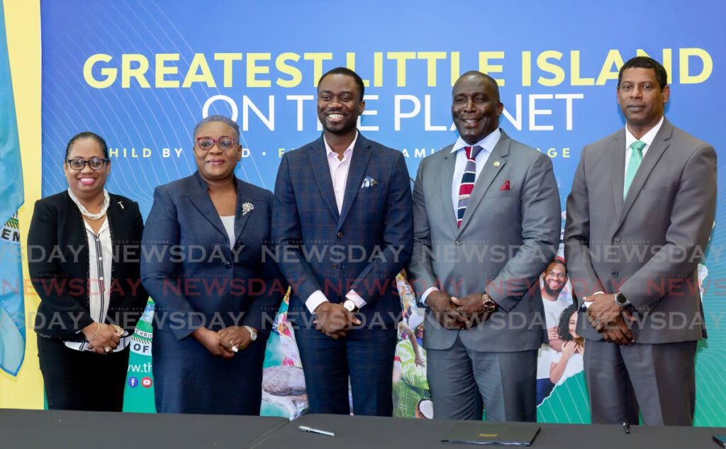 Chief Secretary Farley Augustine (centre) with Habitat for Humanity’s national director, Jennifer Massiah; and Secretary of Settlements, Public Utilities and Rural Development, Ian Pollard at a memorandum of understanding signing ceremony between the Tobago House of Assembly and Habitat For Humanity  at Shaw Park Cultural Complex on Thursday. - David Reid