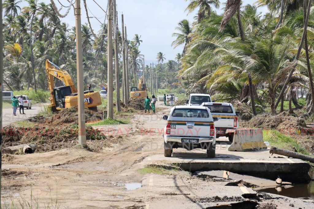 A crew on site for the start of construction of a five kilometre stretch along the Manzanilla Mayaro Road on Friday. - ROGER JACOB