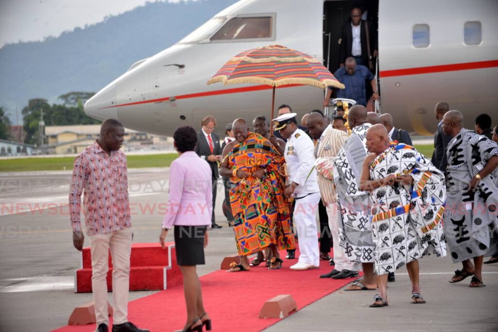 Asantehene Otumfuo Osei Tutu II arrives at Piarco International Airport on Sunday. PHOTO BY ANISTO ALVES - Anisto Alves
