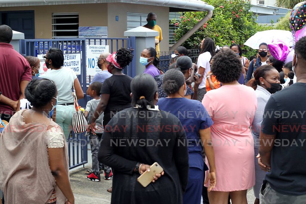 Parents outside the Sacred Heart Girls RC school waiting for their children to complete the SEA exams in March 2022. FILE PHOTO  - 