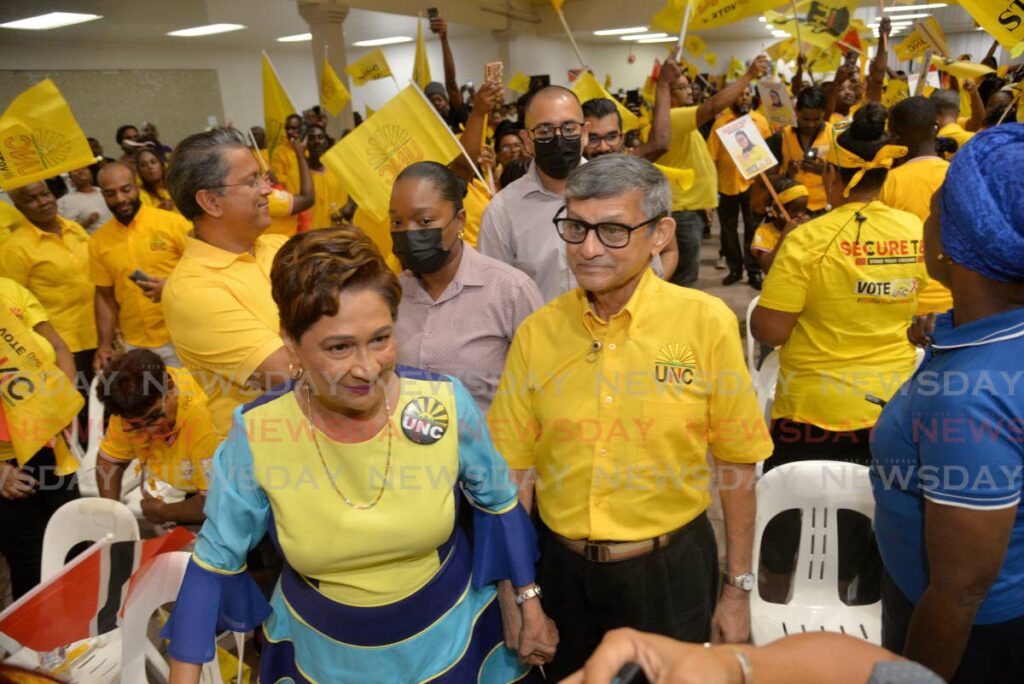 Opposition Leader Kamla Persad-Bissessar and her husband Dr Gregory Bissessar during a meeting at Centre of Excellence, Macoya on July 24. - Photo by Anisto Alves