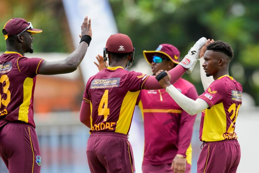 West Indies' Alick Athanaze (R) celebrates after taking the catch to dismiss India's Suryakumar Yadav during the second ODI match at Kensington Oval in Bridgetown, Barbados, on Saturday.  - AP PHOTO