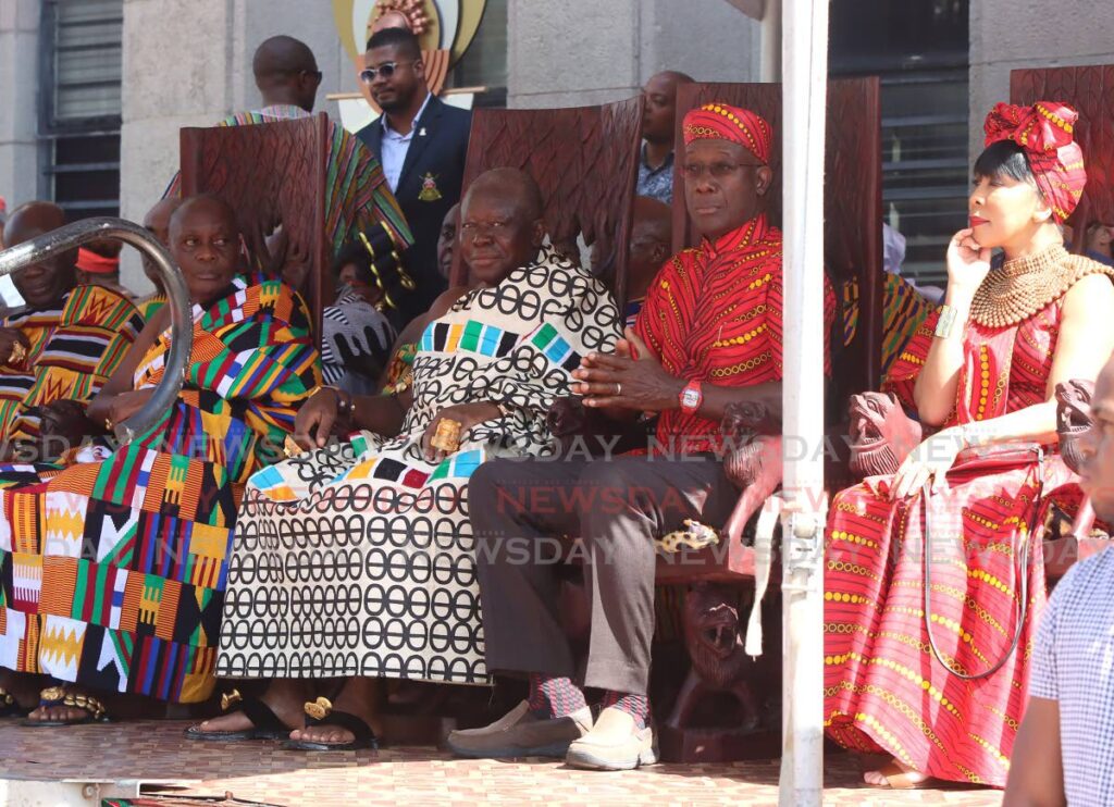 Asantehene Otumfuo Osei Tutu II, from left, Prime Minister Dr Keith Rowley and his wife, Sharon, at  Emancipation Day celebrations in Port of Spain on Tuesday.  - Angelo Marcelle