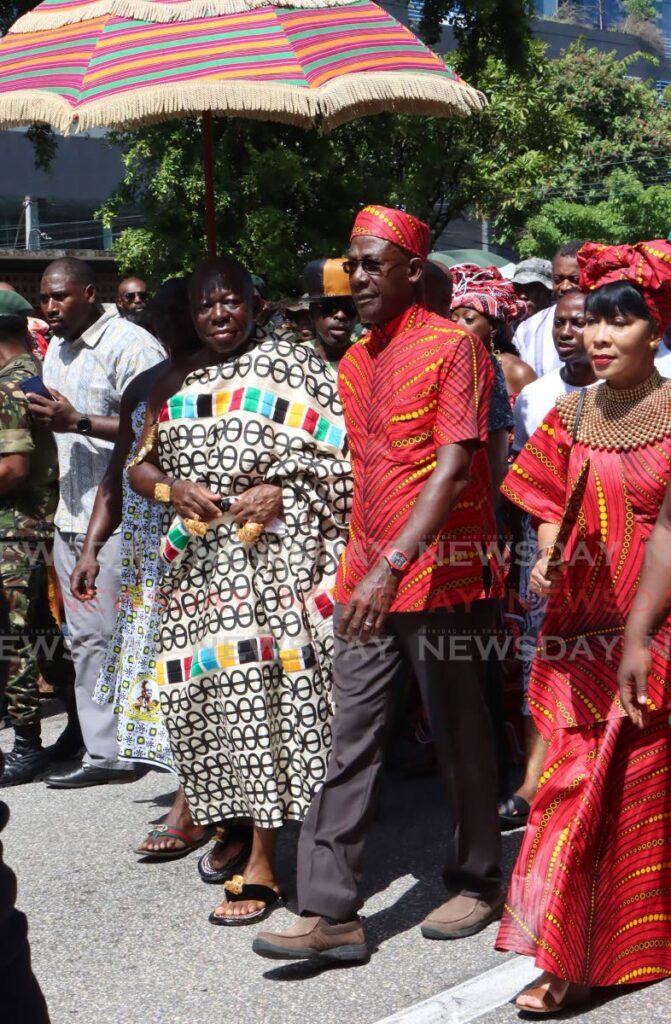 King Tutu II with Prime Minister Dr Keith Rowley and his wife Sharon Rowley during the Emancipation Day procession in Port of Spain.  - Angelo Marcelle