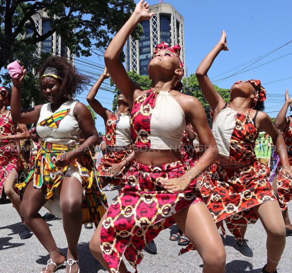 In this file photo, dancers dance along Independence Square near the Twin Towers during the Emancipation Day procession in Port of Spain.  - Photo by Angelo Marcelle