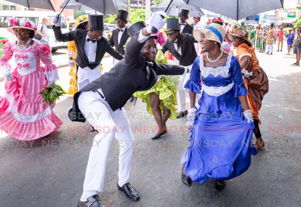 DANCING WIT D BRIDE: The Moriah Ole Time Wedding performers were part of Tobago Emancipation Day celebrations at Crown Point Tobago on Tuesday. - Photo by David Reid