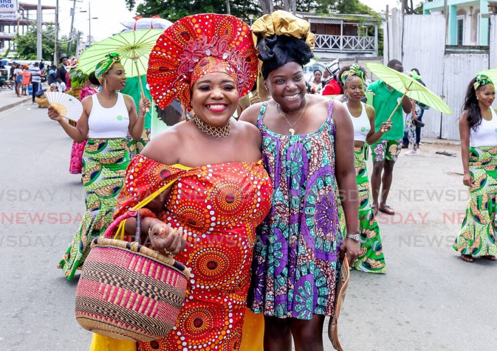 BASKET IN TOW: Secretary of Tourism, Culture, Antiquities and Transportation Councilor Tashia Burris, happily poses for a photo with Assistant Secretary of Tourism, Culture, Antiquities and Transportation Megan Morrison, left, in the Tobago Emancipation Day celebrations at Crown Point in 2023. - File photo by David Reid