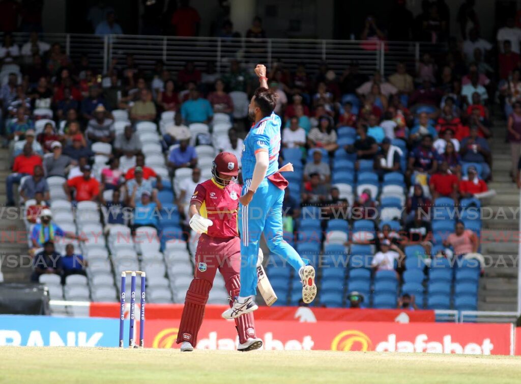 Indian bowler Mukesh Kumar jumps for joy with the dismissal of West Indies captain Shai Hope,  during the India vs West Indies 3rd One Day International at the Brian Lara Stadium, Tarouba, on Tuesday. - Anisto Alves