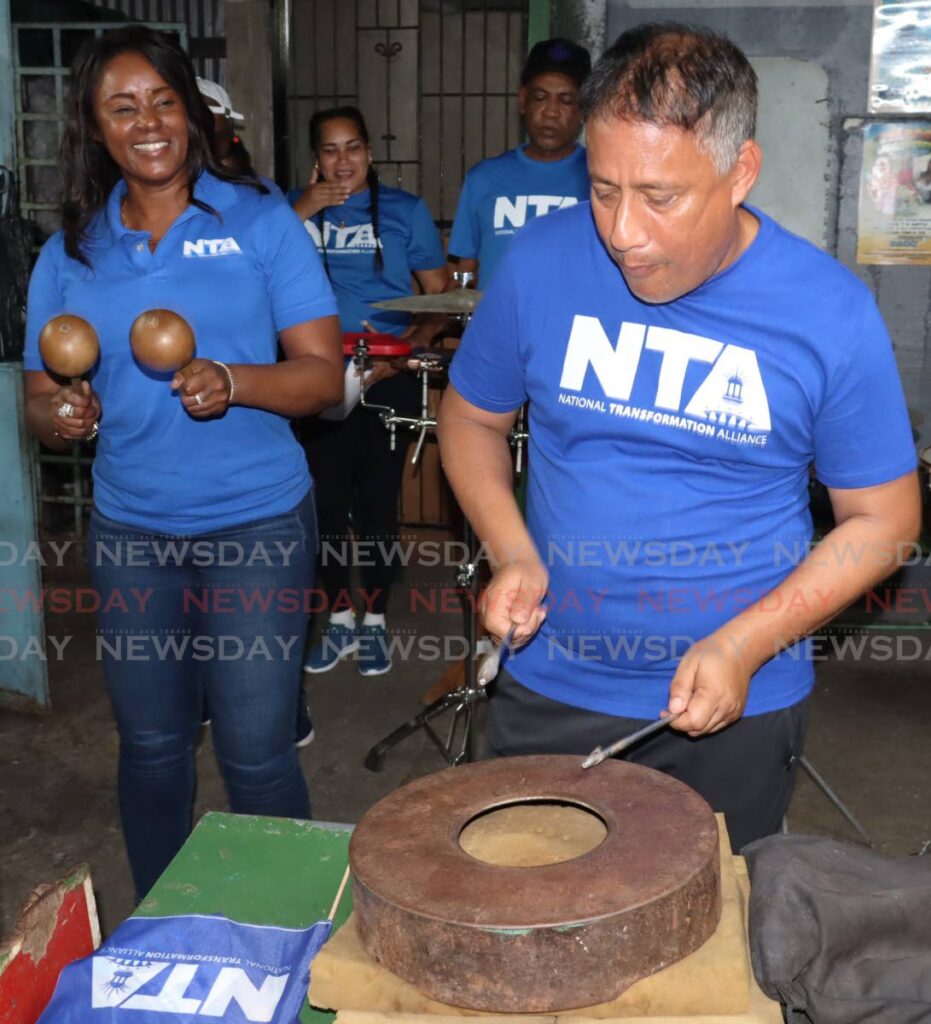 TAPPED UP: Nicole Dyer-Griffith, left, and her husband Gary Griffith during an NTA walkabout in July. - ROGER JACOB