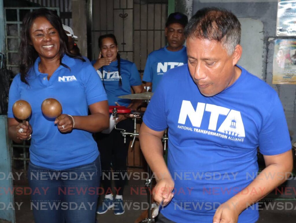 TAPPED UP: Nicole Dyer-Griffith, left, and her husband Gary Griffith during a recent NTA campaign walkabout in East Trinidad. Dyer-Griffith is claiming the cellphones belonging to her her and Griffith have been tapped. FILE PHOTO - ROGER JACOB