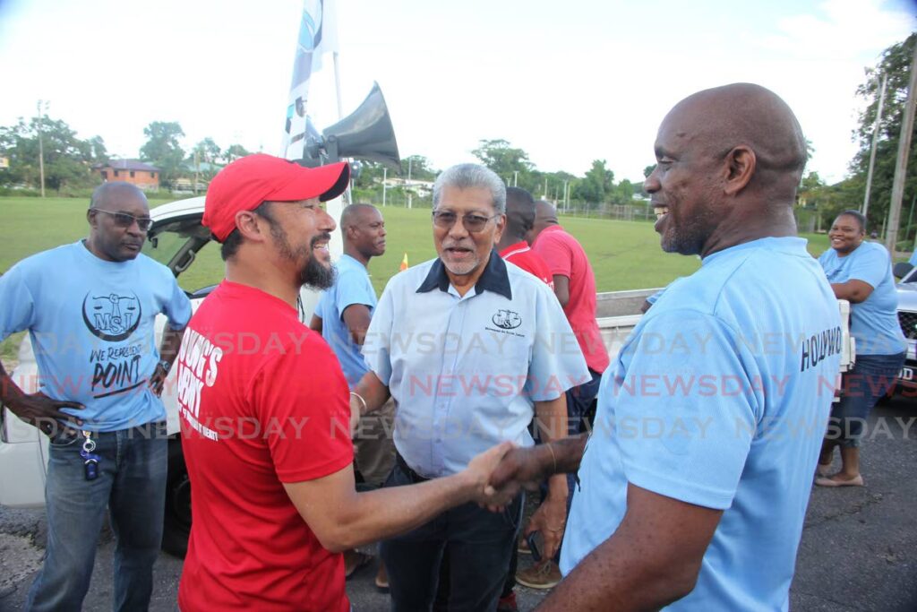 PNM chairman Stuart Young greets MSJ leader David Abdulah and MSJ local government candidate for Techier/Guapo Nigel Whyte as the parties campaign at Savannah Road, Point Fortin on Friday. - Lincoln Holder