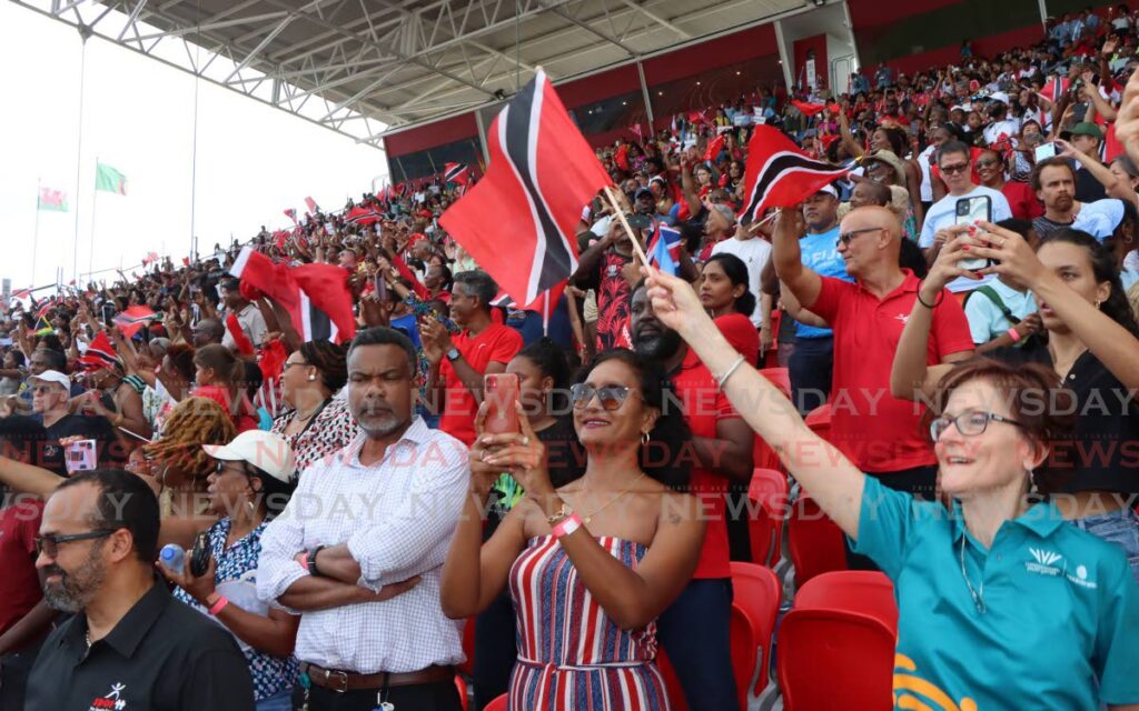 Supporters raise a cheer to the TT team, Hasely Crawford Stadium, Port of Spain. - 