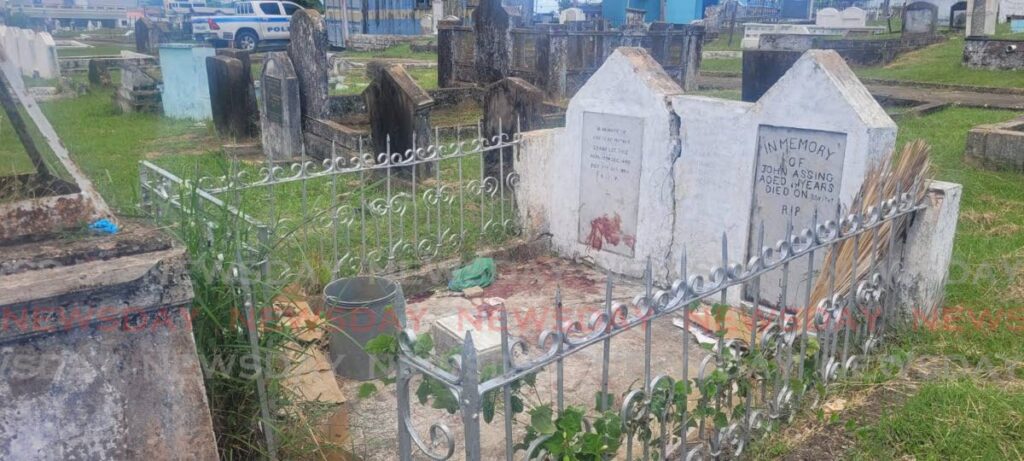 The gravesite where a street dweller was found stabbed to death at Paradise Cemetery, San Fernando on Saturday.  - Laurel V Williams