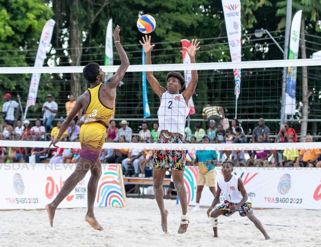 TT boys' (white) volleyballers defend against Sri Lanka during their game at the 2023 Commonwealth Youth Games, at the Courlad Beach Sports Arena, in Black Rock, Tobago, - Photo by David Reid