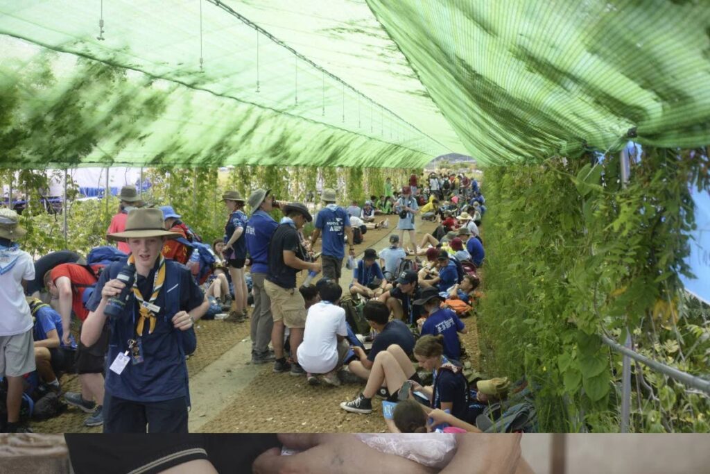 Attendees at the World Scout Jamboree rest in the shade at a scout camp site Buan, South Korea. AP PHOTO - 