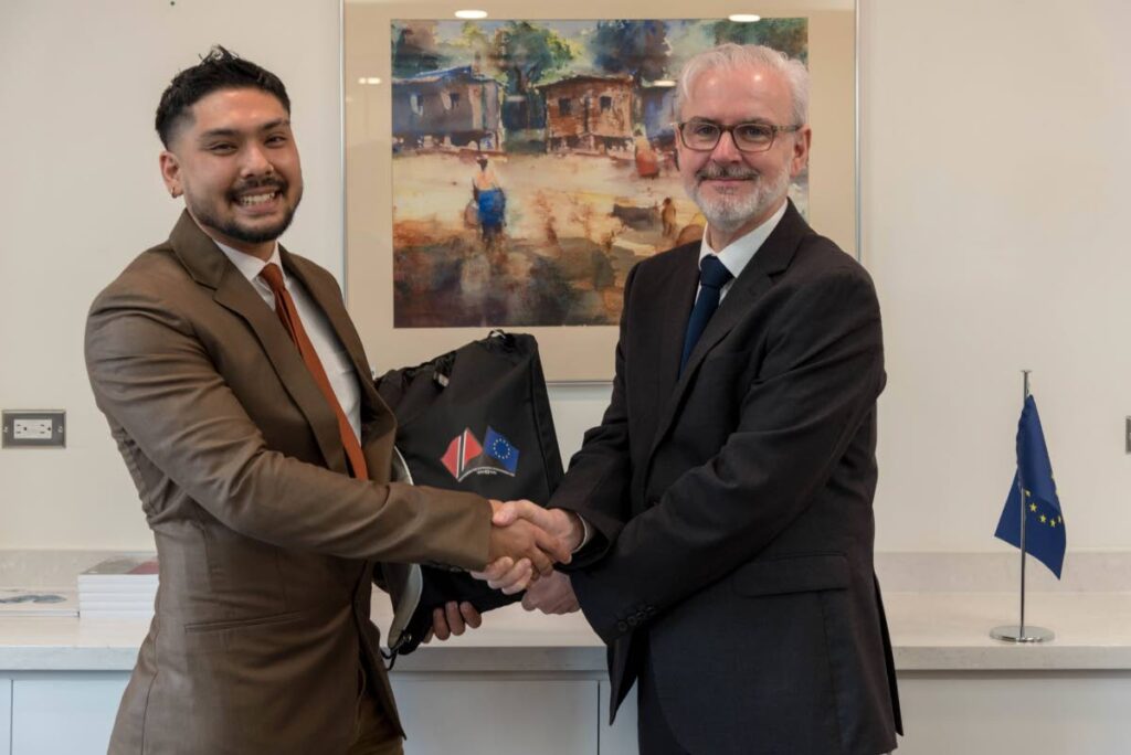 Scott Marchack  with EU Ambassador to TT Peter Cavendish. Marchack will do a master’s degree in work organisational and personnel psychology under the Erasmus Mundus Joint Master’s Degree programme. - 