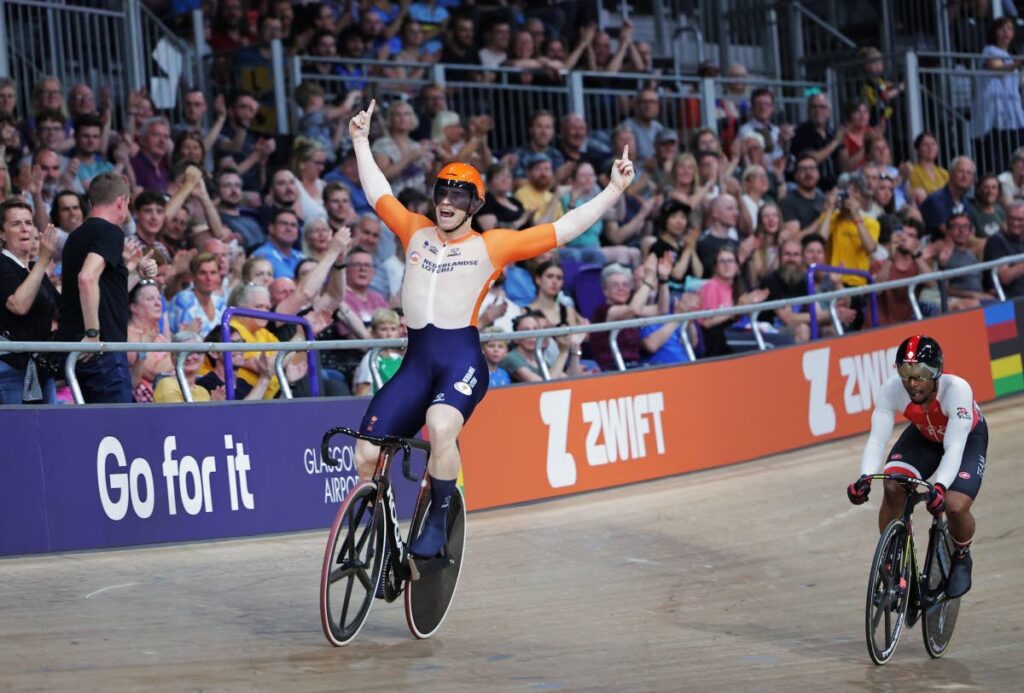 Dutchman Harrie Lavreysen soaks in the applause of the crowd at the Sir Chris Hoy Velodrome, after beating TT's Nicholas Paul, right, in the World Championships men's sprint final in Glasgow, Scotland, Monday.  - UCI