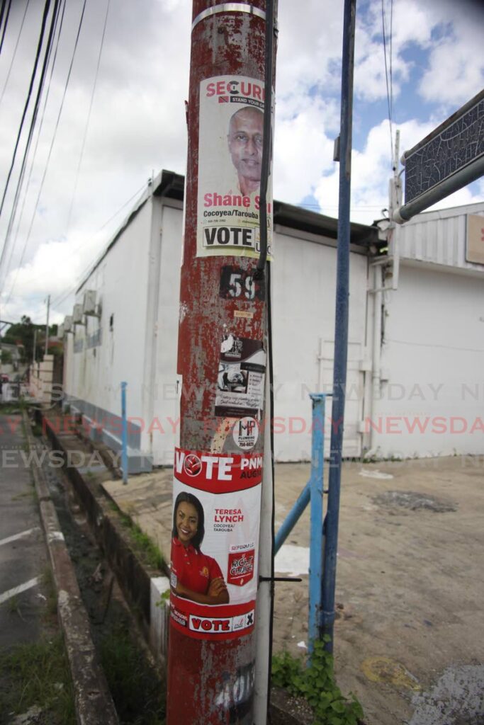 Posters of UNC candidate for Cocoyea/Tarouba, Shane Samlal and PNM candidate Teresa Lynch on a light pole in the Gopaul Lands area for the upcomming local government elections. - Lincoln Holder