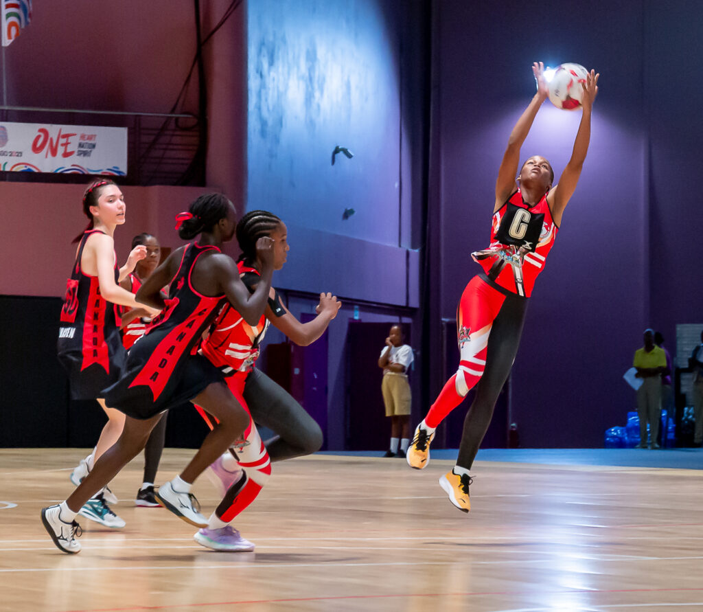 A Trinidad and Tobago player jumps to collect a pass during a Fast5 Netball match against Canada in the Commonwealth Youth Games, at Shaw Park Cultural Complex indoor court, Tuesday. Photo by David Reid
