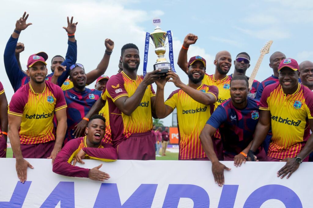 West Indies celebrate with the trophy after beating India in the fifth and last T20 match at Central Broward Regional Park in Lauderhill, Florida, Sunday. - AP