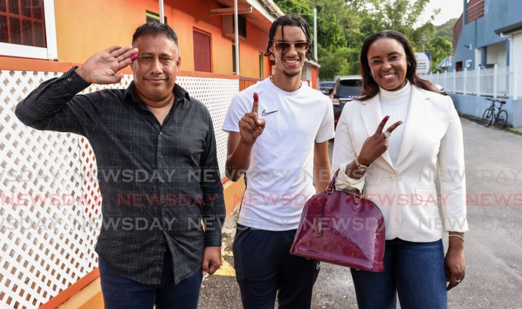 NTA leader Gary Griffith, his wife Nicole Dyer-Griffith and their son Gary Griffith III at Maraval Community Centre after voting in Monday's local government election. - Jeff K Mayers